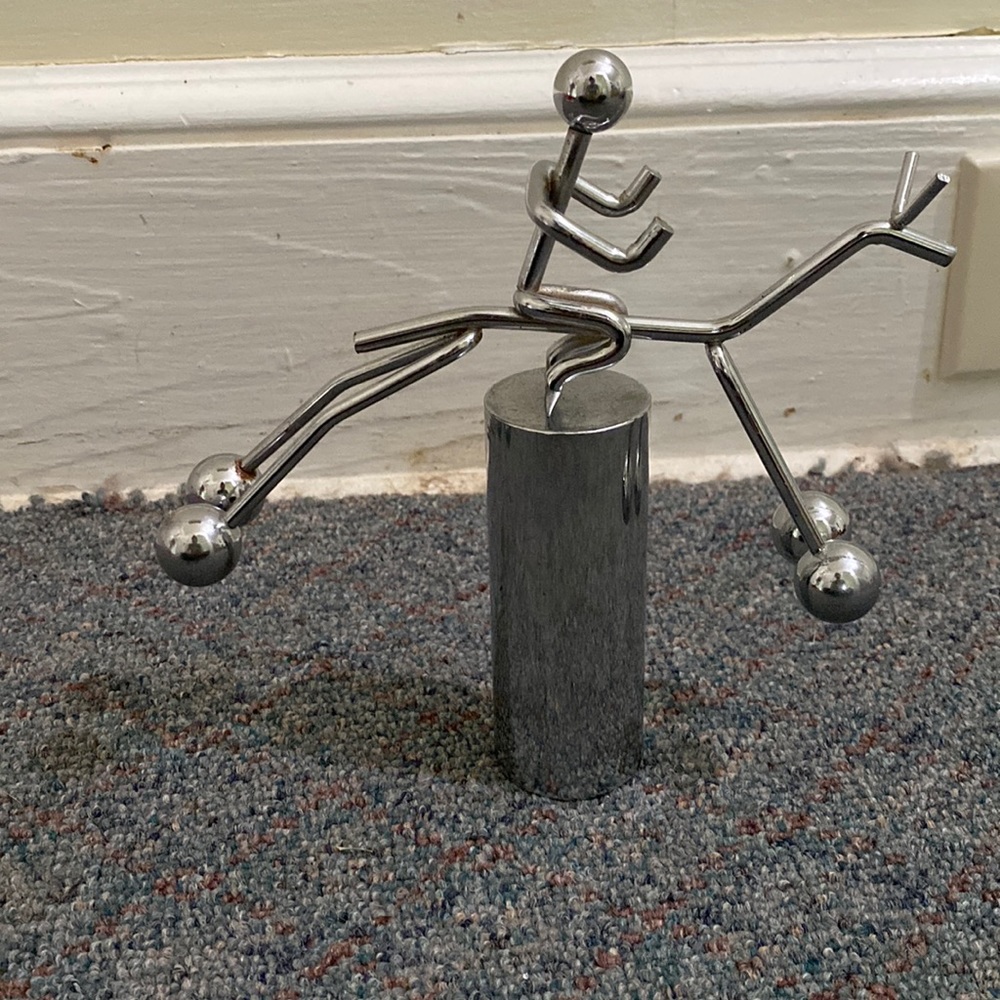 Balancing Man on Horse Figurine